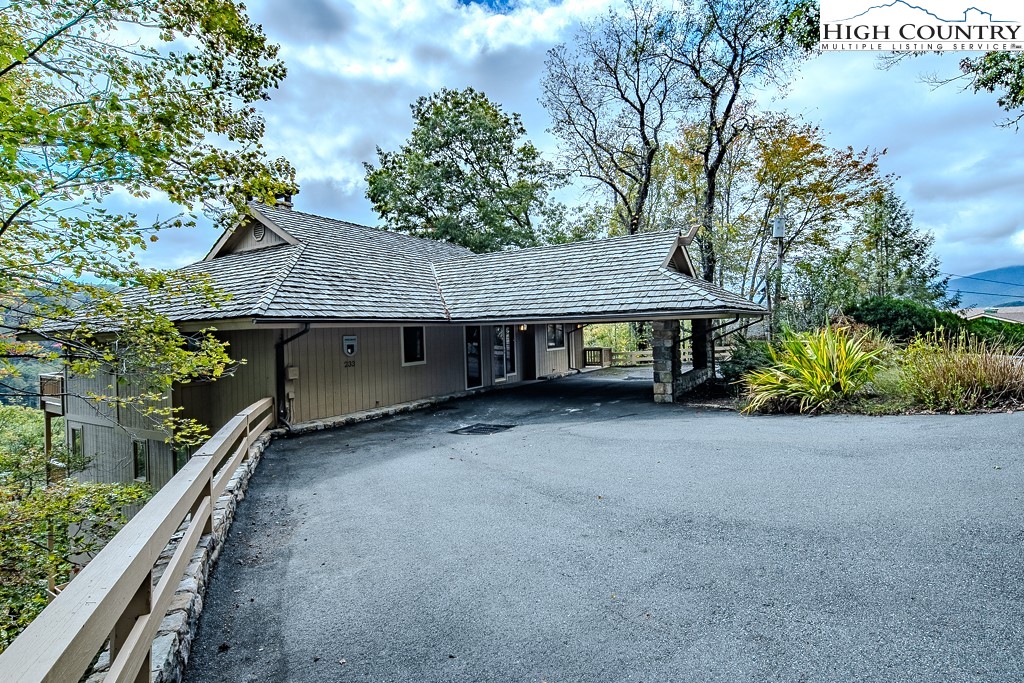 233 Balsam Road Boone, NC 28607 - Photo 2 of 50 a view of a house with a yard plants and large tree