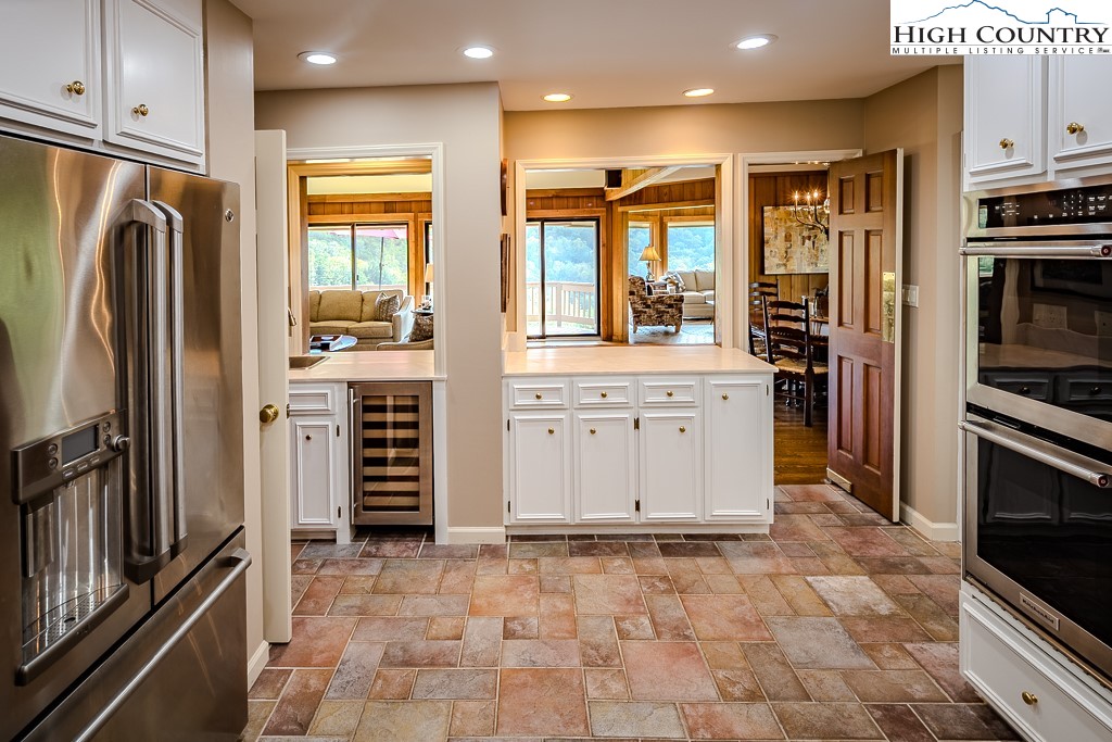 233 Balsam Road Boone, NC 28607 - Photo 24 of 50 a kitchen with stainless steel appliances a refrigerator sink and stove