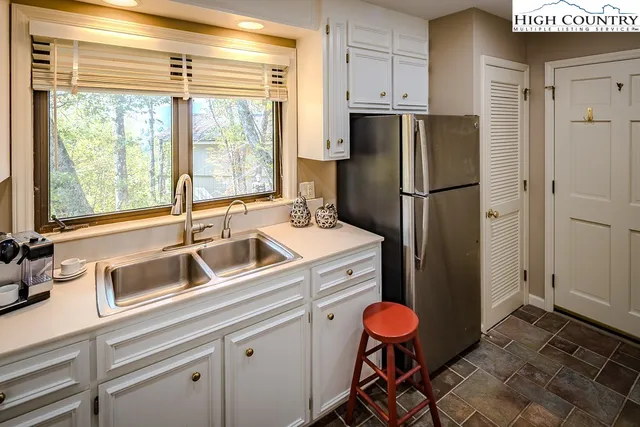 a bathroom with a sink a mirror and a shower