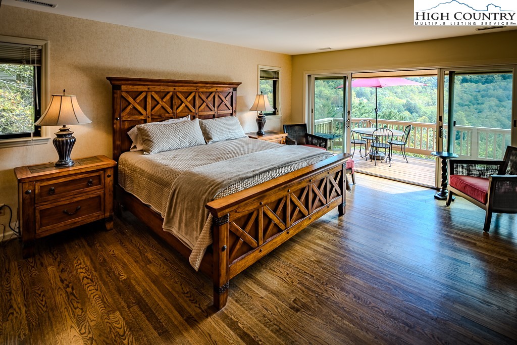 233 Balsam Road Boone, NC 28607 - Photo 28 of 50 a bed sitting in a bedroom next to a window