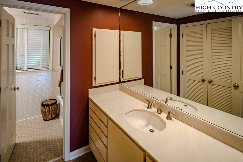 233 Balsam Road Boone, NC 28607 - Photo 31 of 50 a bathroom with a sink and a mirror