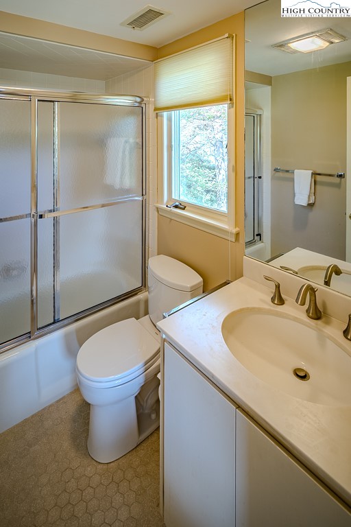 233 Balsam Road Boone, NC 28607 - Photo 36 of 50 a bathroom with a sink toilet and shower