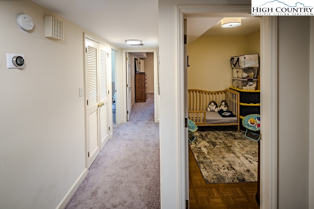 233 Balsam Road Boone, NC 28607 - Photo 39 of 50 a view of a hallway view with two couch and a dining table