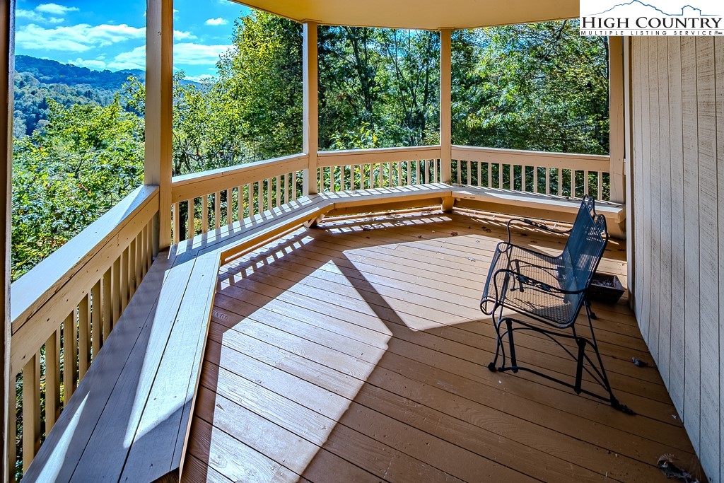 233 Balsam Road Boone, NC 28607 - Photo 44 of 50 a view of a wooden deck with a bench