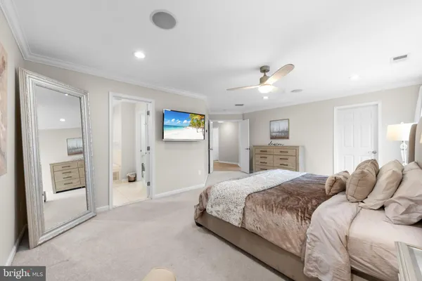 a bedroom with a bed and a lamp