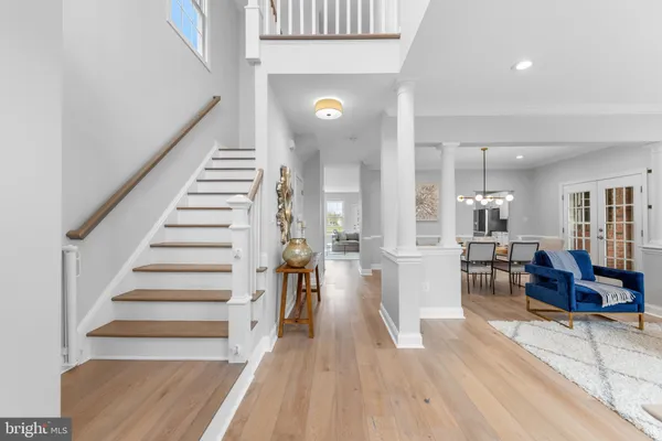 a view of a living room and entryway with furniture