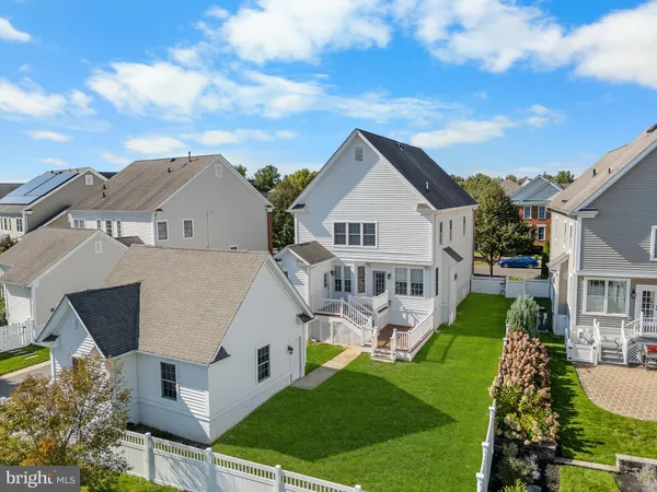 a aerial view of a house with swimming pool and porch