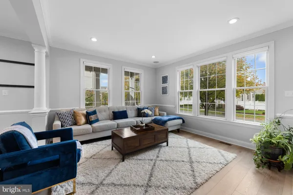 a living room with furniture and windows