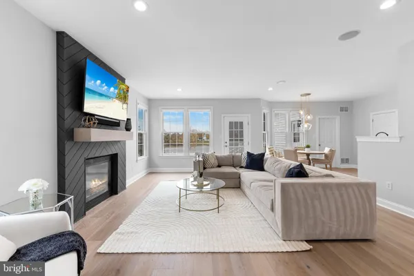a living room with fireplace furniture and a fireplace