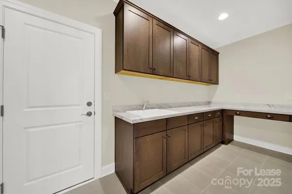 a kitchen with a sink and cabinets