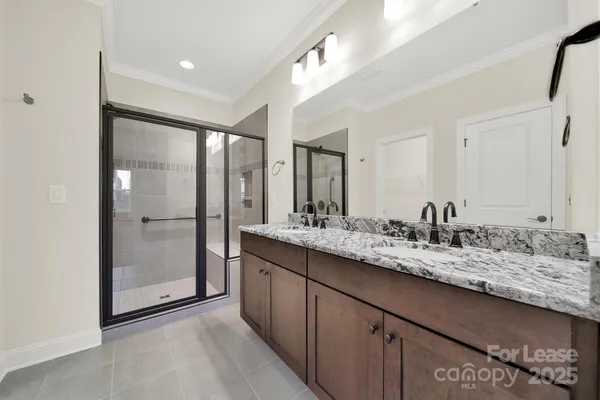 a bathroom with a granite countertop sink mirror and double