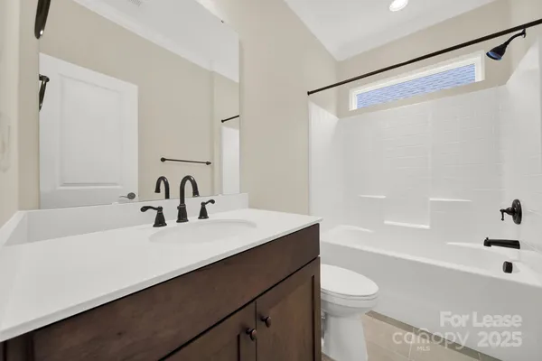 a bathroom with a sink a toilet and a bathtub