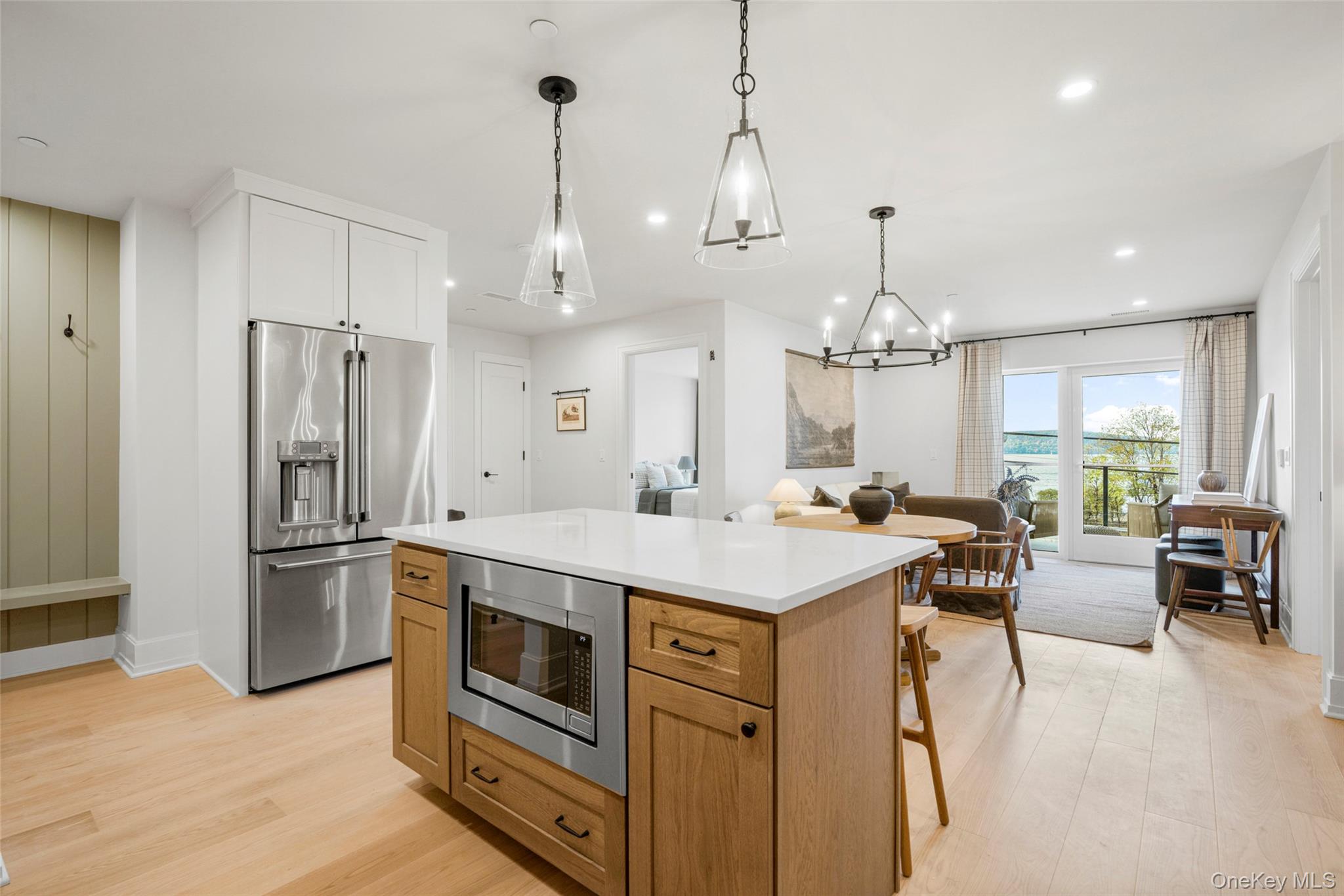 25 South Riverside Avenue, Unit 108 Croton-on-Hudson, NY 10520 - Photo 9 of 27 Kitchen featuring appliances with stainless steel finishes, light wood finished floors, show elegance and sophistication throughout