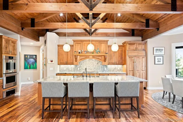 a kitchen with sink stove and cabinets