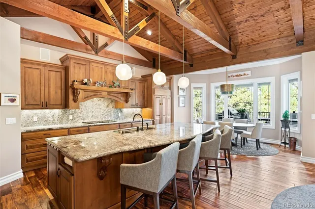 a spacious bedroom with a bed a couch and a flat screen tv