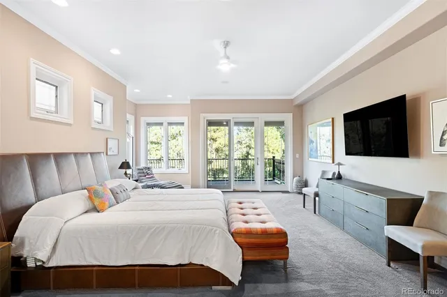 a spacious bedroom with a bed and a couch