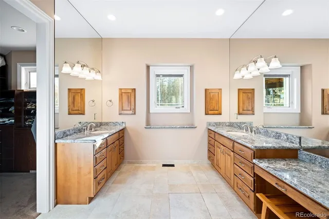 a bedroom with a balcony furniture and a large window