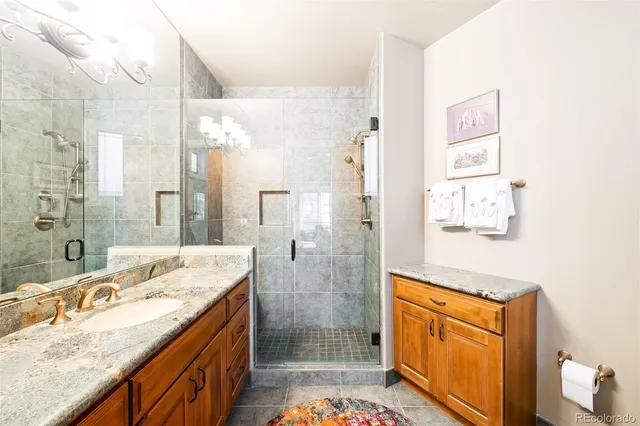 a living room with fireplace furniture and a chandelier