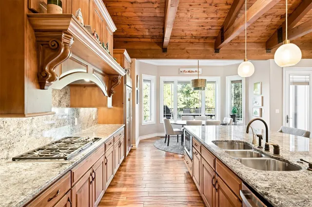 a view of a kitchen with kitchen island a large window in it