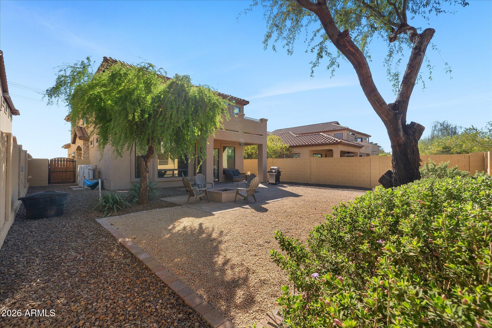 8536 East Inca Street Mesa, AZ 85207 - Photo 34 of 44 a front view of a house with a yard and a garage