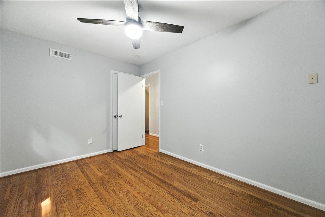 111 Braddock Road Williamsburg, VA 23185 - Photo 23 of 43 Unfurnished room featuring wood finished floors and ceiling fan