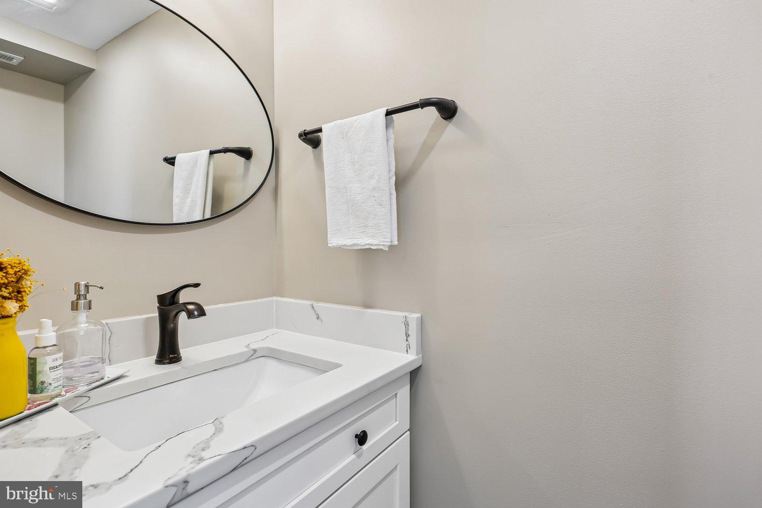 30 Hamilton Avenue Frederick, MD 21701 - Photo 14 of 37 a bathroom with a sink and mirror