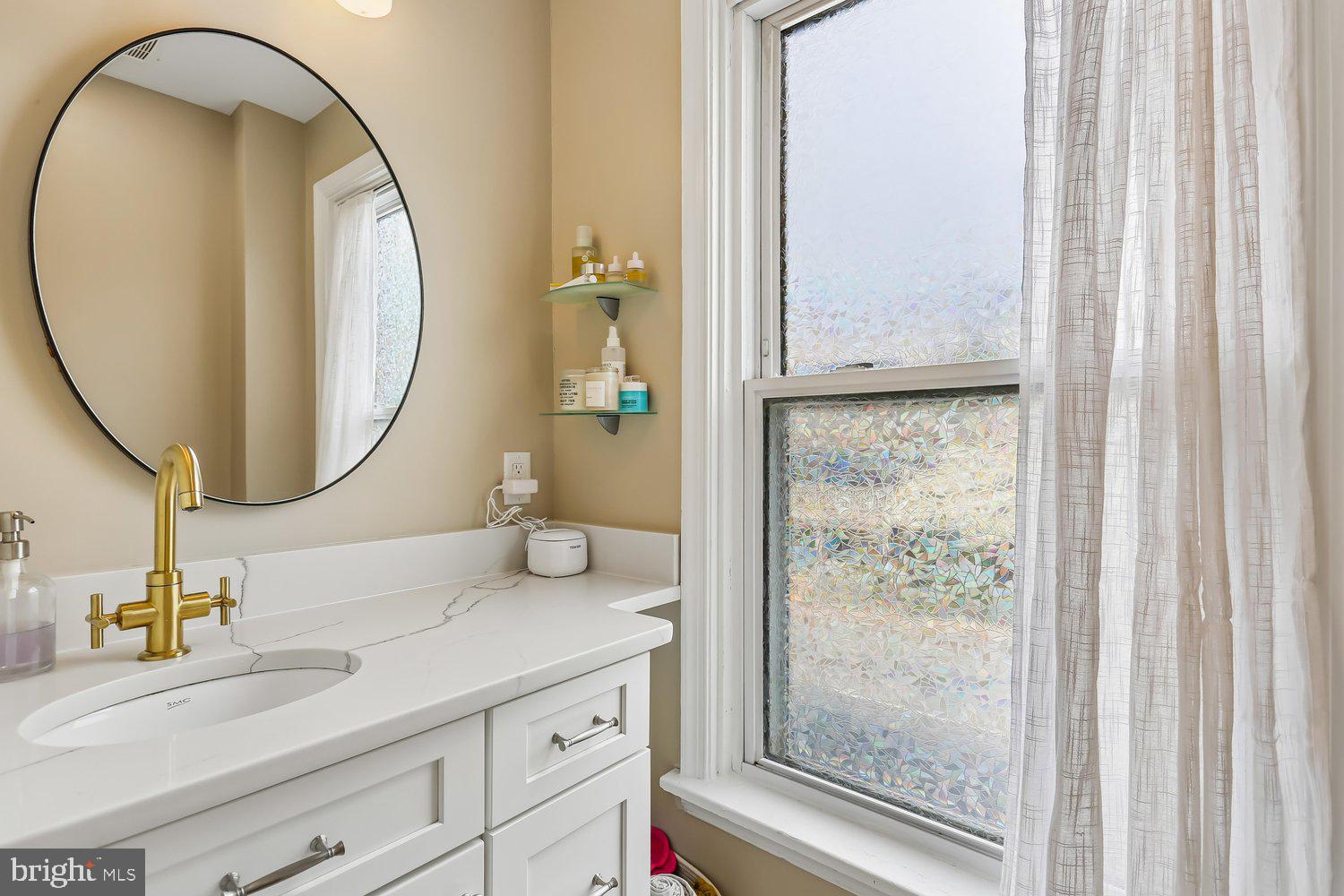 30 Hamilton Avenue Frederick, MD 21701 - Photo 19 of 37 a bathroom with a sink and a mirror