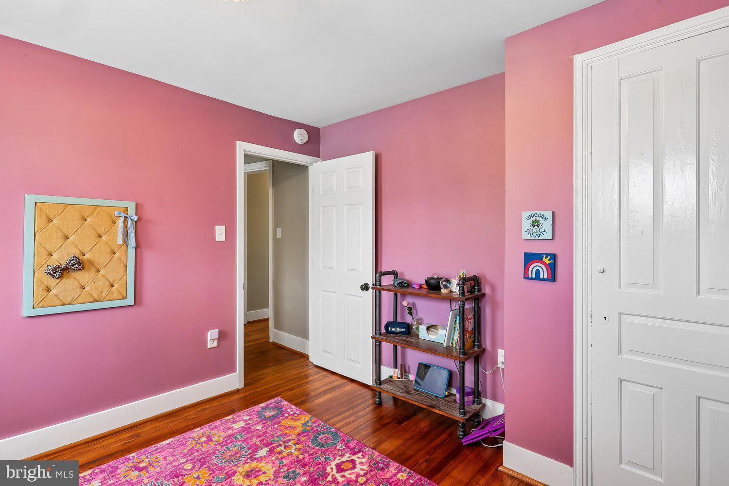 30 Hamilton Avenue Frederick, MD 21701 - Photo 23 of 38 Charming room with vibrant pink walls.