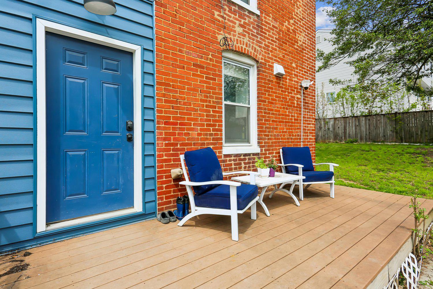 30 Hamilton Avenue Frederick, MD 21701 - Photo 32 of 37 a view of a deck with table and chairs with wooden fence and floor