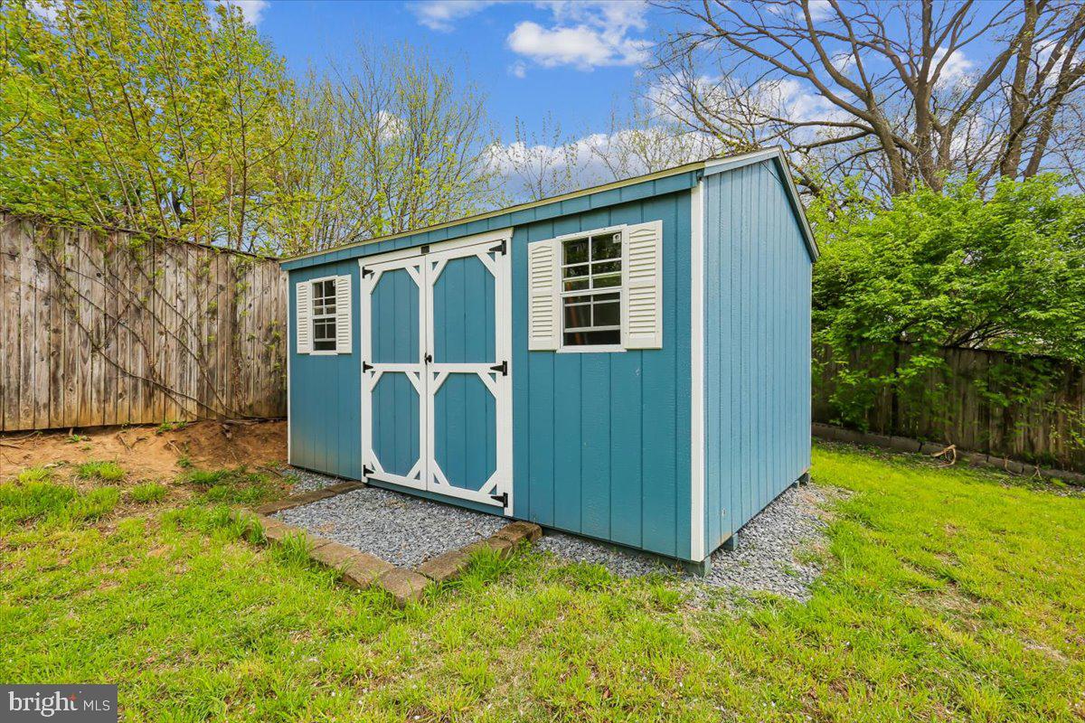 30 Hamilton Avenue Frederick, MD 21701 - Photo 37 of 38 Charming garden shed in vibrant blue.