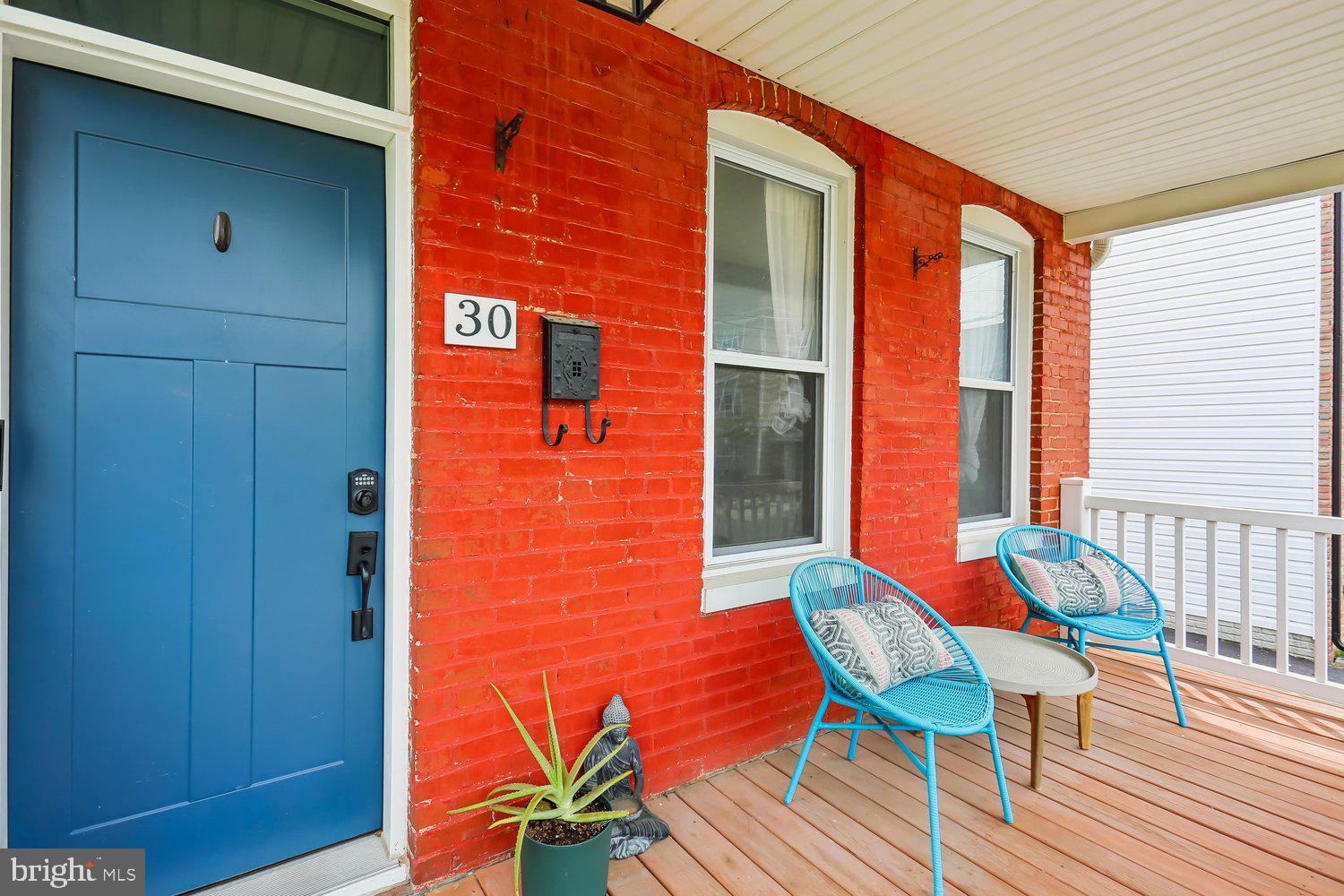 30 Hamilton Avenue Frederick, MD 21701 - Photo 4 of 38 Charming entryway with vibrant red brick.