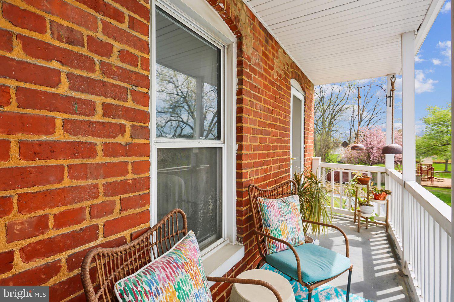 30 Hamilton Avenue Frederick, MD 21701 - Photo 4 of 37 a view of a balcony with chairs and a potted plant