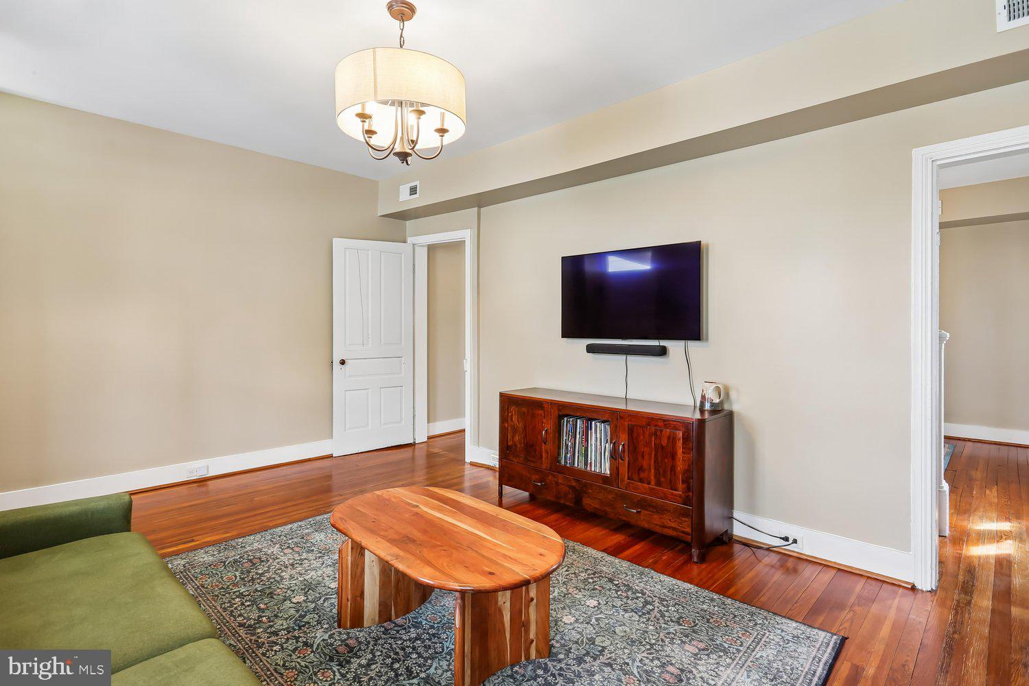 30 Hamilton Avenue Frederick, MD 21701 - Photo 9 of 38 Charming living space with warm wood accents.