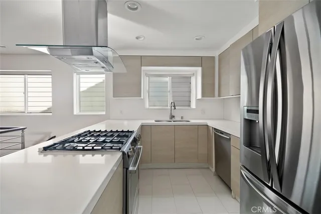 a kitchen with a sink stove and refrigerator