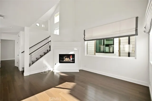 a view of an entryway with wooden floor and a window