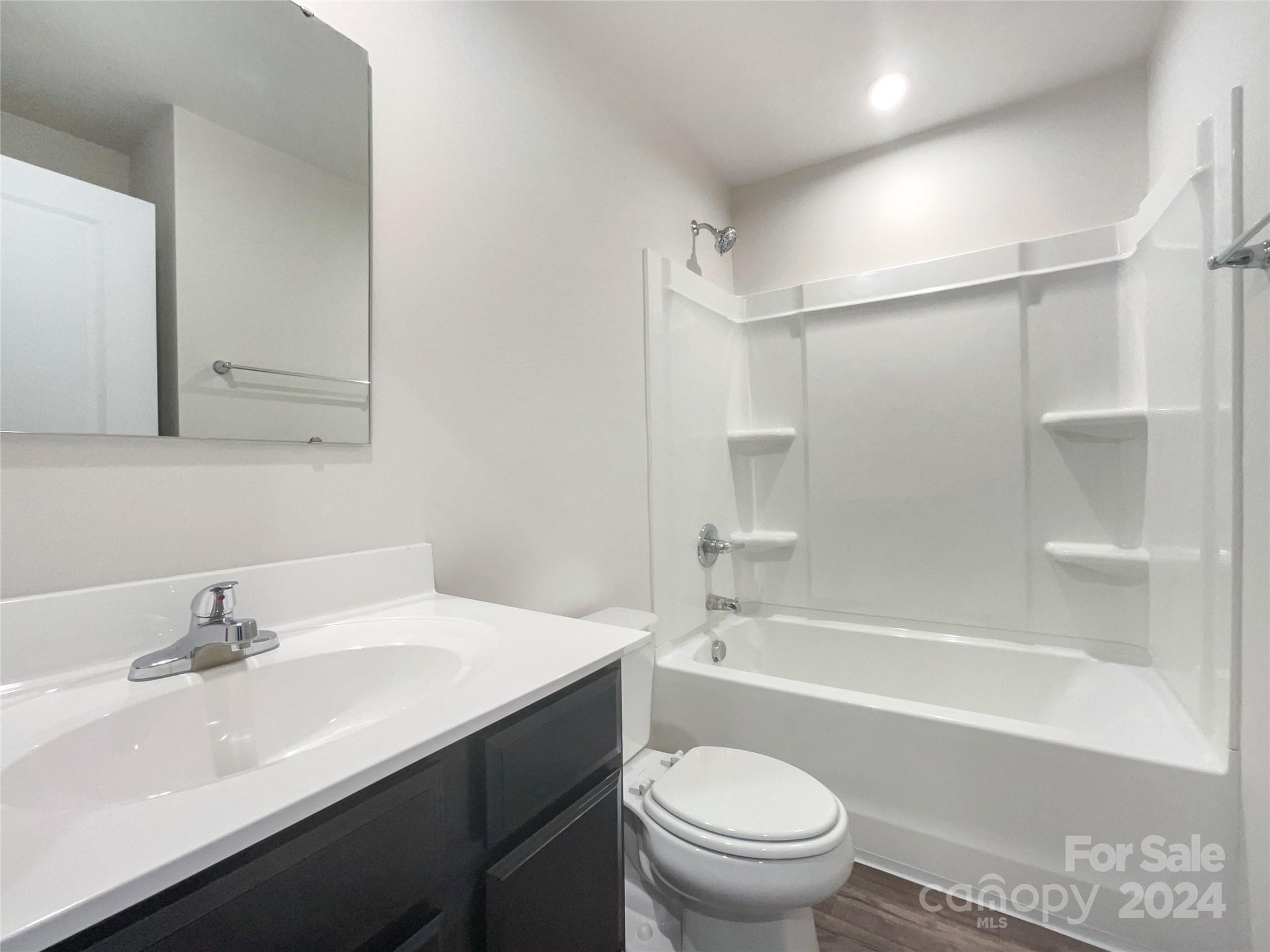 708 Dillon Way Fort Mill, SC 29715 - Photo 17 of 19 a bathroom with a sink a toilet and a bathtub