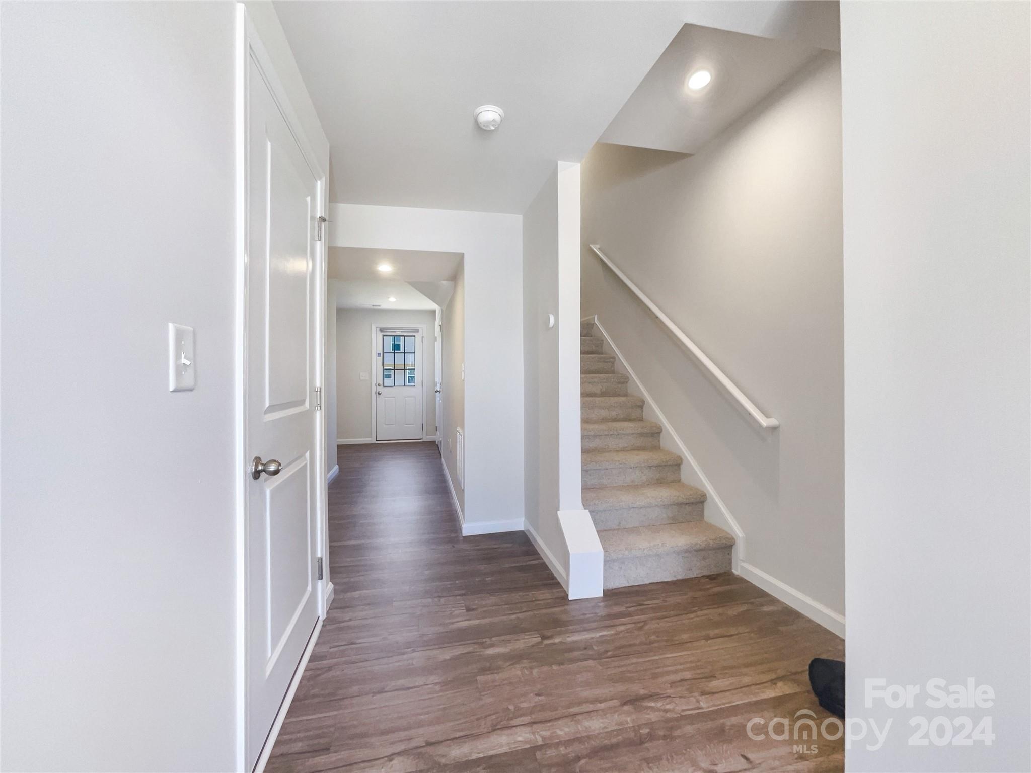 708 Dillon Way Fort Mill, SC 29715 - Photo 8 of 19 a view of a hallway with wooden floor and entryway