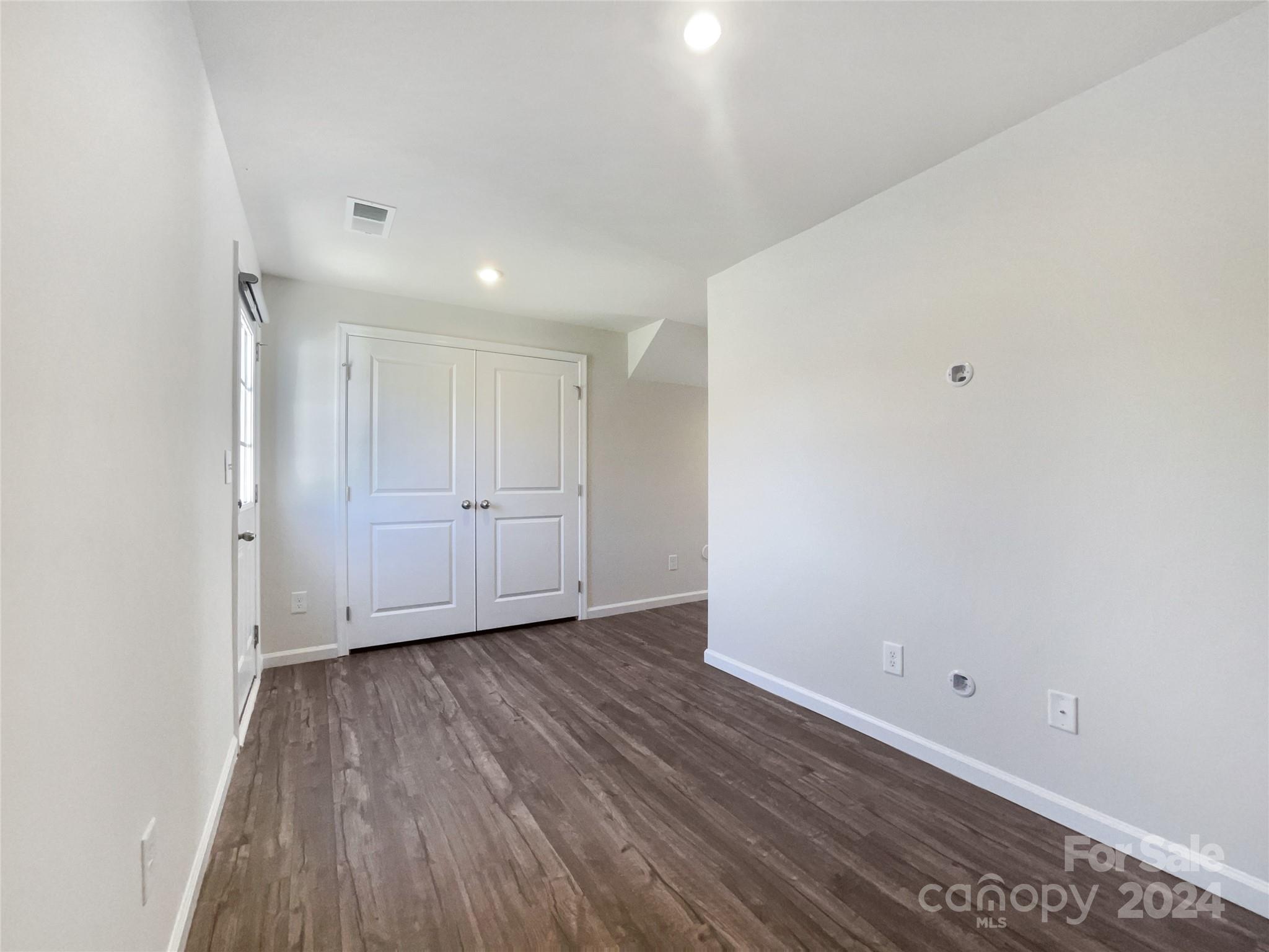 708 Dillon Way Fort Mill, SC 29715 - Photo 9 of 19 a view of an empty room with wooden floor