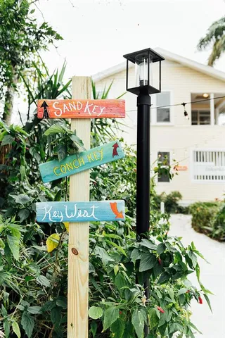 a front view of a building with garden