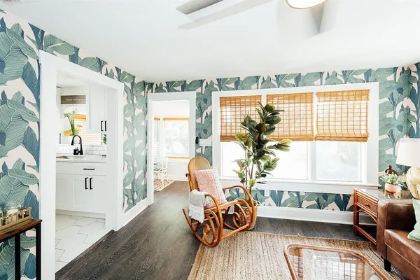 a utility room with furniture and wooden floor