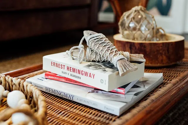 a view of a dining room with furniture and a window