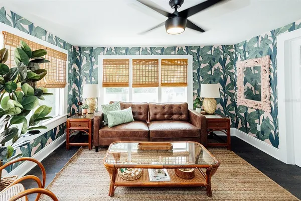 a living room with furniture and a large window