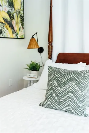 a glass vase with flowers on a table