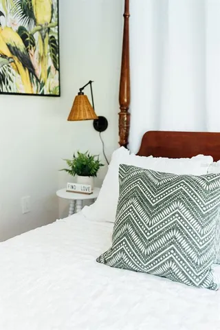 a glass vase with flowers on a table