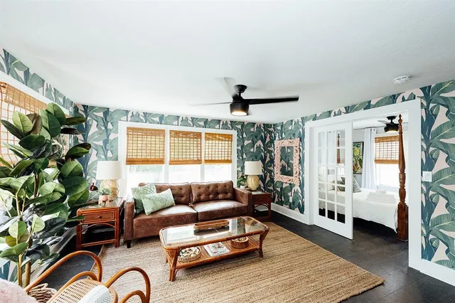 a living room with furniture and a window