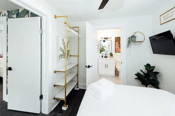 a view of a house with backyard sitting area and garden