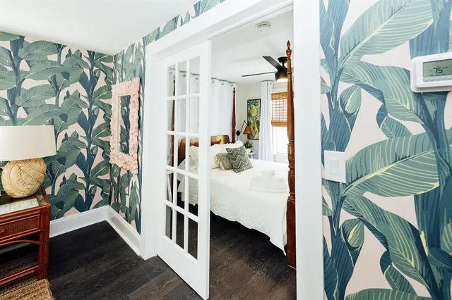 a living room with furniture and wooden floor