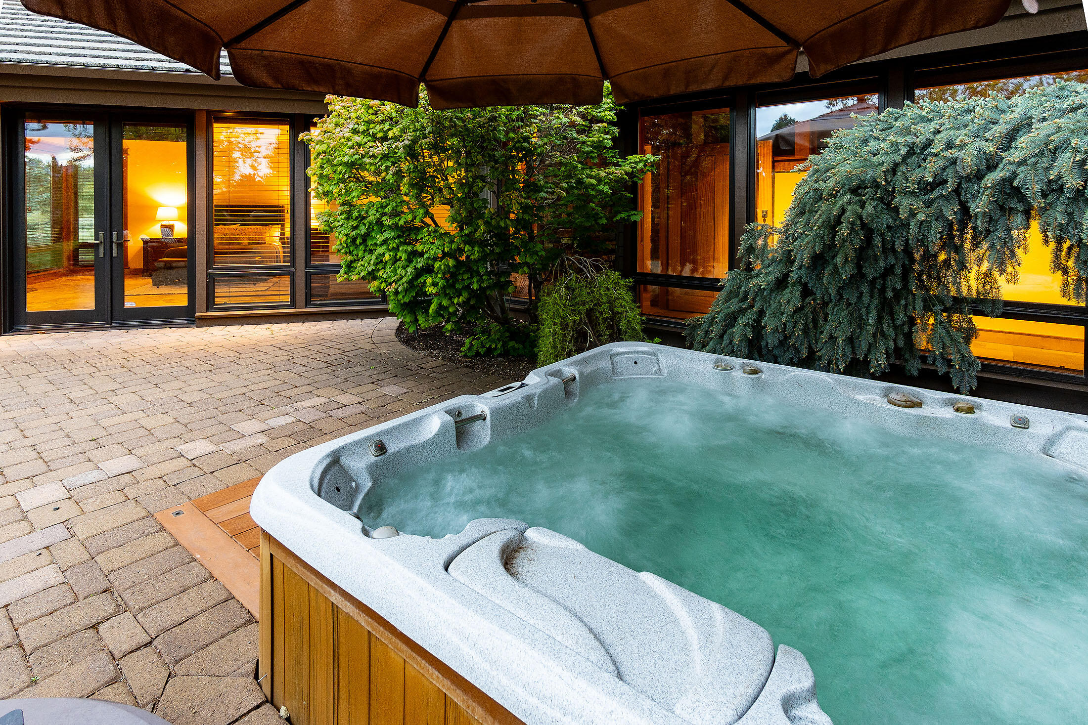 18883 Sutherland Court Bend, OR 97702 - Photo 53 of 70 Rejuvenate in the spa-style hot tub beneath Oregon?s endless skies.