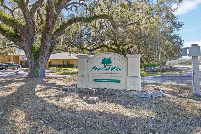 a view of a tree in front of a house