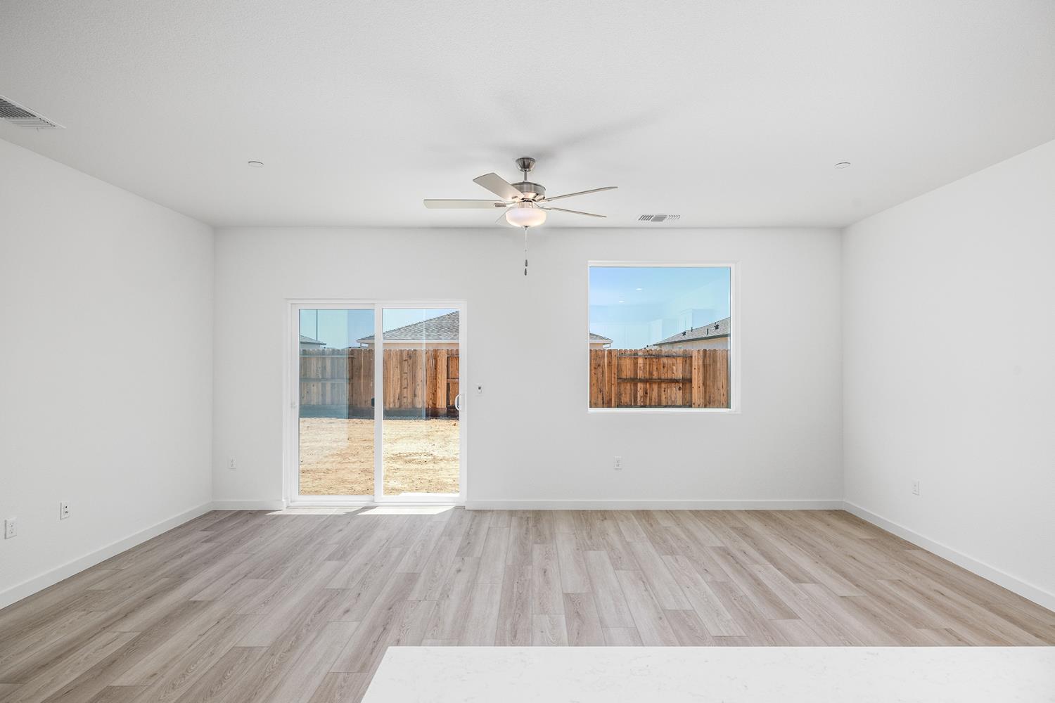 3053 Isley Way Stockton, CA 95212 - Photo 8 of 8 wooden floor in an empty room with a window
